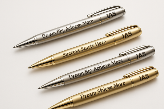 Engraved pens with motivational messages or "IAS" branding.